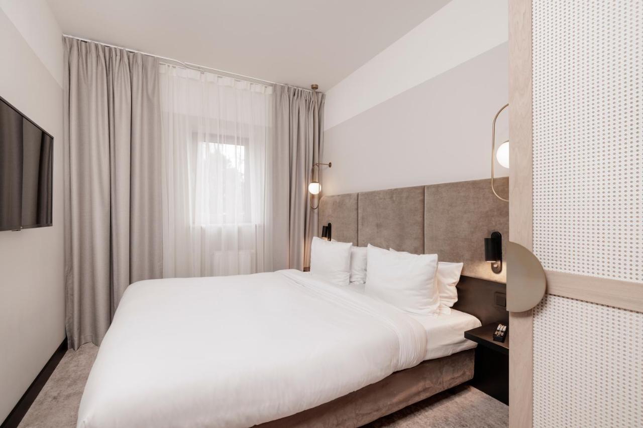 Royal Tulip Sand Kolobrzeg Bagian luar foto A bedroom at the hotel